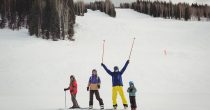 family-having-fun-while-skiing