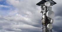 telecommunications-towers-against-cloudy-sky