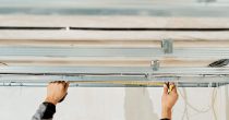 worker-s-hands-measure-adjust-metal-profile-mounting-plasterboard-ceiling-frame-close-up-selective-focus-hands-specialist-industrial-renovation-renovation