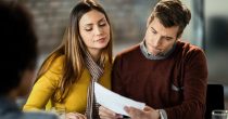 uncertain-couple-analyzing-savings-plan-while-having-business-meeting-with-financial-advisor